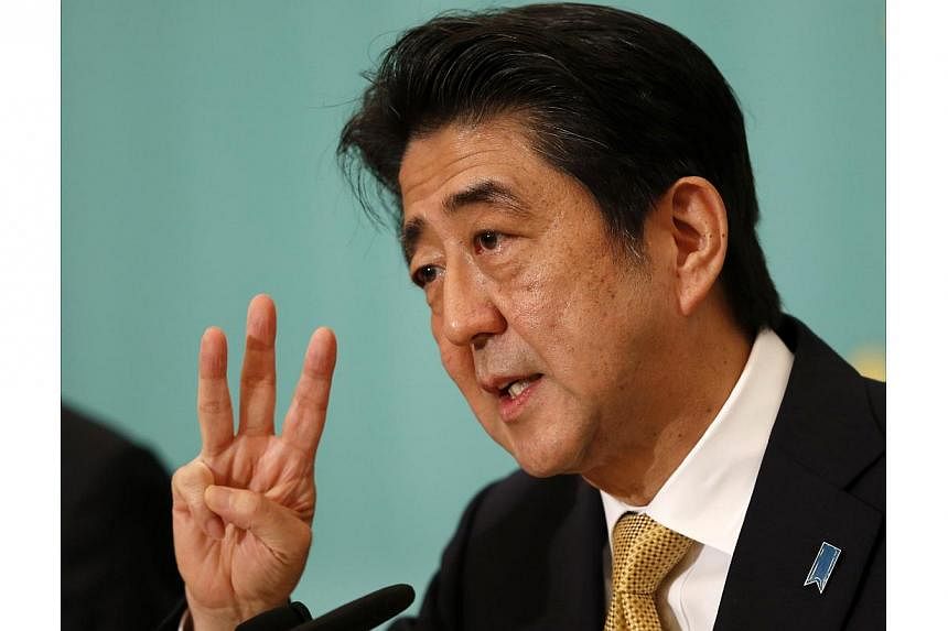 Japanese Prime Minister Shinzo Abe is suspected of calling the snap election in an attempt to give himself another four years in office. The election was technically not due until December 2016. -- PHOTO: REUTERS