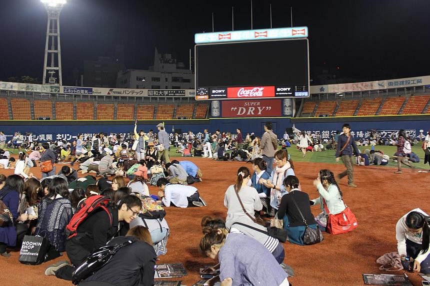 People taking part in a large-scale escape game at a stadium in Yokohama, Japan. They were locked up and had to solve puzzles against the clock to break out. Only 120 out of 1,600 participants made it through in the game's first edition. A local vers