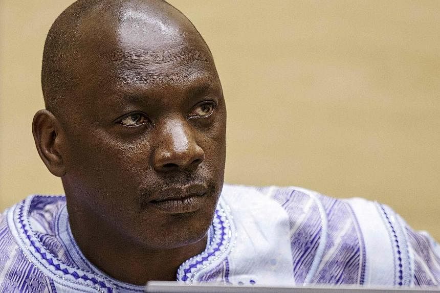 Former Congolese warlord Thomas Lubanga awaits the judges' verdict in the courtroom of the International Criminal Court (ICC) in The Hague on Monday. Appeals judges upheld his conviction for using child soldiers in the Democratic Republic of Congo, b