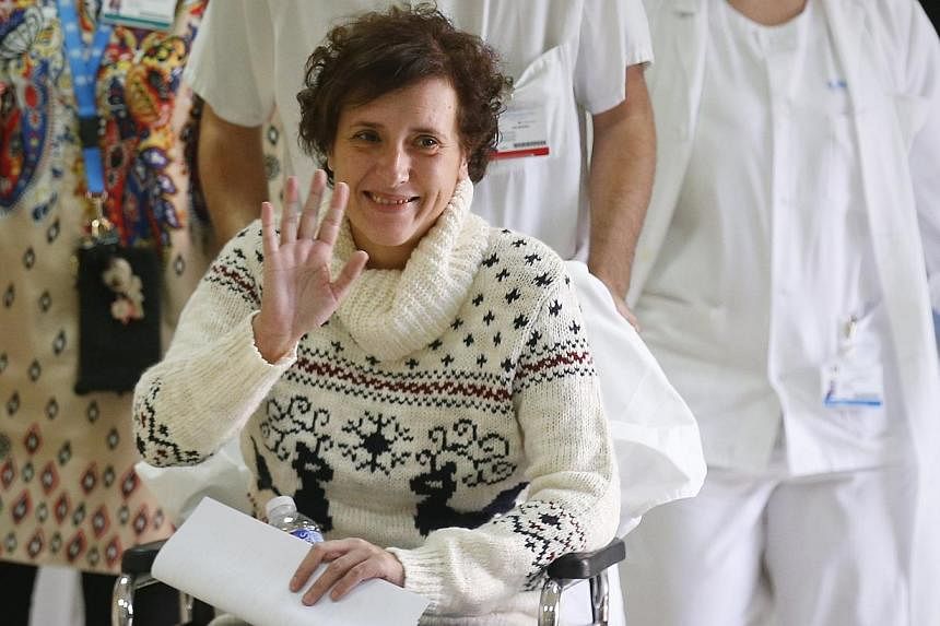 Spanish nurse Teresa Romero, who contracted Ebola, smiles after being discharged from hospital in Madrid on Nov 5, 2014.&nbsp;The World Health Organisation on Tuesday declared Spain free of Ebola after going a month and a half with no new cases since