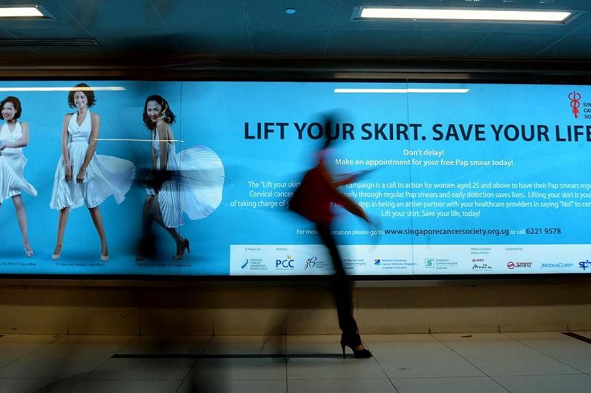 An ad promoting awareness of preventive measures for cervical cancer in Singapore in 2013. The WHO now recommends nine to 13-year-old girls should receive two doses of the HPV vaccine, rather than the previous three. -- PHOTO: ST FILE