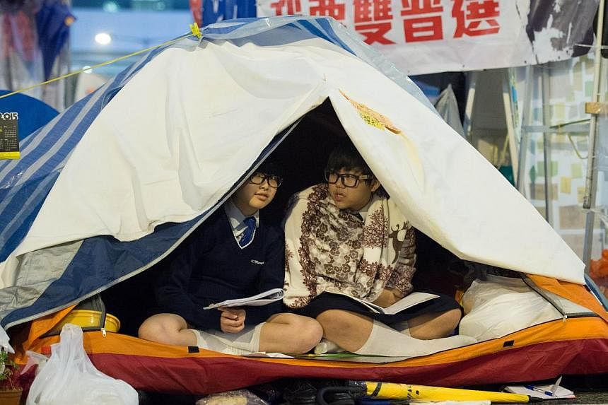 Students in their tents at the pro-democracy movement's main protest site in the Admiralty district of Hong Kong on Dec 2, 2014. -- PHOTO: AFP