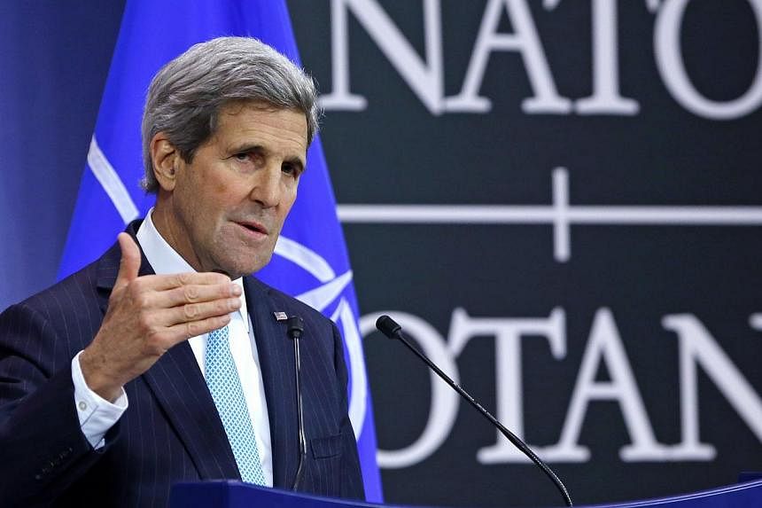 US Secretary of State John Kerry holds a news conference during a NATO foreign ministers meeting at the alliance's headquarters in Brussels. -- PHOTO: REUTERS