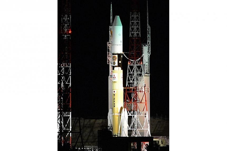 Japan's H-IIA rocket moves to the launch pad of the Japan Aerospace Exploration Agency (JAXA) Tanegashima Space Centre on Dec 3, 2014. -- PHOTO: AFP