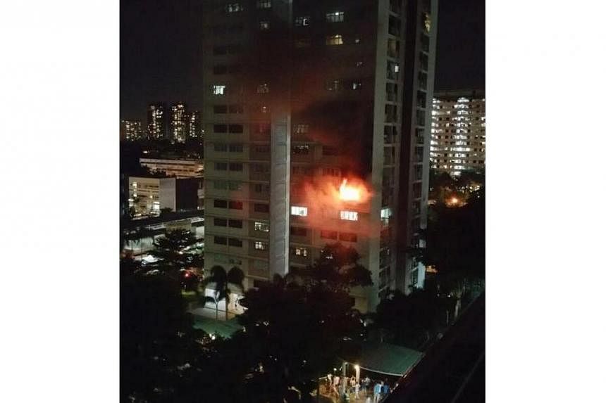 A fire broke out in a flat at Block 8, Ghim Moh road&nbsp;on Wednesday night. -- PHOTO: ERIC LI