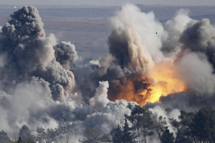 Smoke rises over Syrian town of Kobane after an airstrike on Oct 18, 2014, part of an offensive by a US-led coalition against the Islamic State in Iraq and Syria (ISIS).&nbsp;The coalition has inflicted serious damage on ISIS, carrying out around 1,0