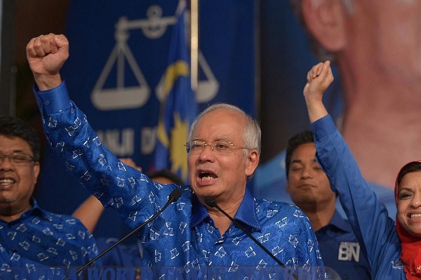 Malaysian Prime Minister Najib Razak (centre) addressing supporters at the Putra World Trade Centre after the Barisan Nasional was declared the winning coalitian of Malaysia’s 13th general election.&nbsp;An official Malaysian inquiry on Wednesday c