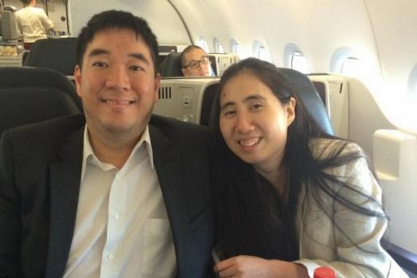 US couple Matthew (left) and Grace Huang leaving Doha. The pair have been cleared of wrongdoing in their adopted daughter's death. -- PHOTO: ERIC VOLZ/ TWITTER&nbsp;