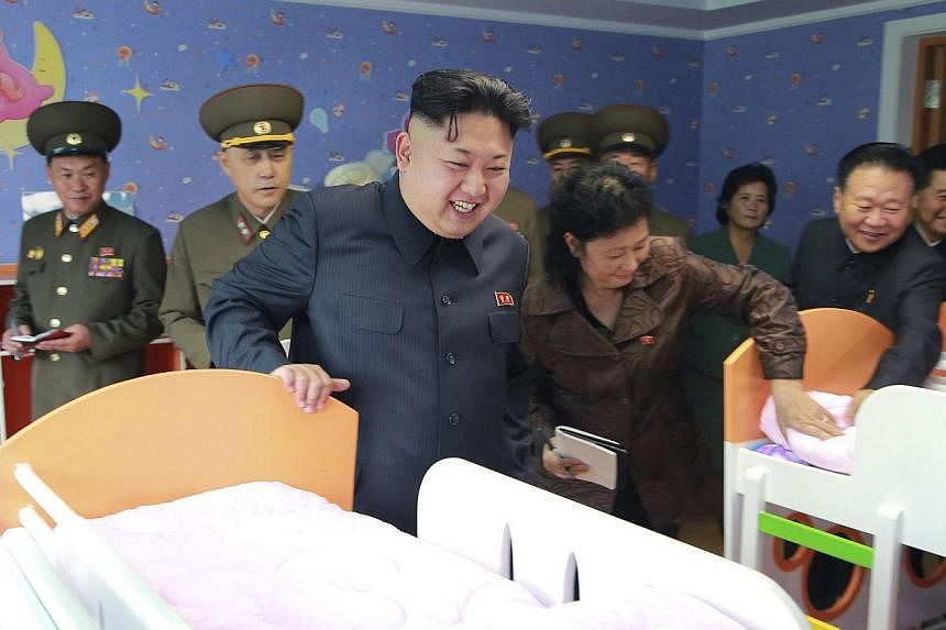 North Korean leader Kim Jong Un visits the Pyongyang Baby Home and Orphanage, in this undated photo released on Oct 26, 2014. A year before he came to power, a directive was issued for anyone sharing his name to change it - maintaining a tradition up