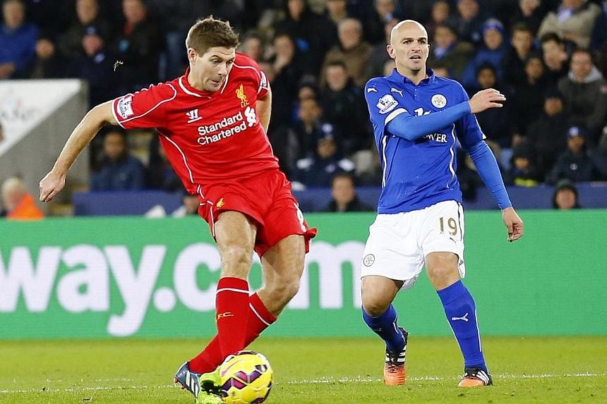 Liverpool's Steven Gerrard (left) shoots to score a goal during their English Premier League match against Leicester City at the King Power Stadium in Leicester on Dec 2, 2014. -- PHOTO: REUTERS