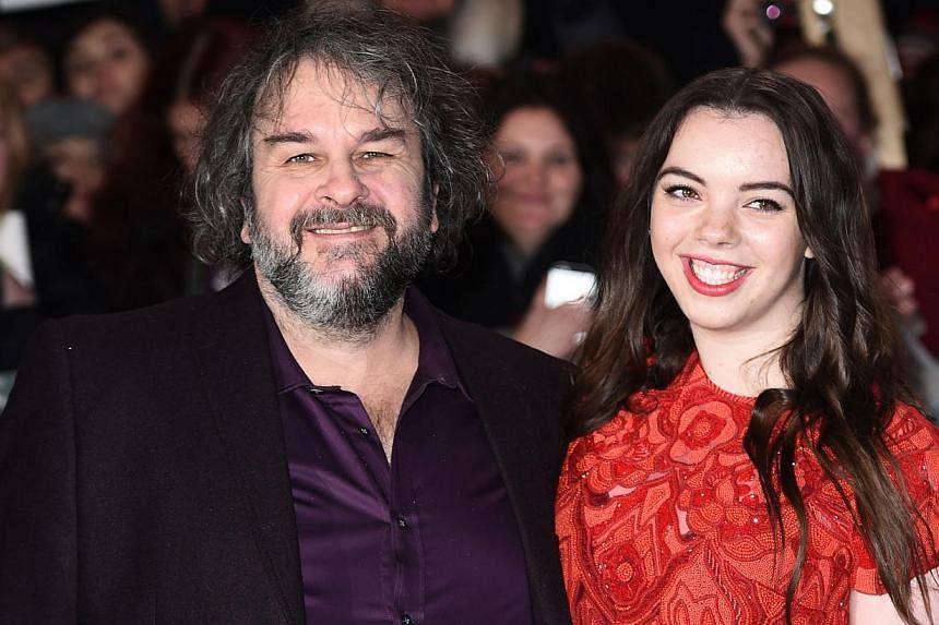 New Zealand director Peter Jackson poses for pictures on the red carpet with daughter Katie upon arrival for the world premier of The Hobbit: The Battle Of The Five Armies in central London on Dec 1, 2014. New films based on the works of J.R.R. Tolki