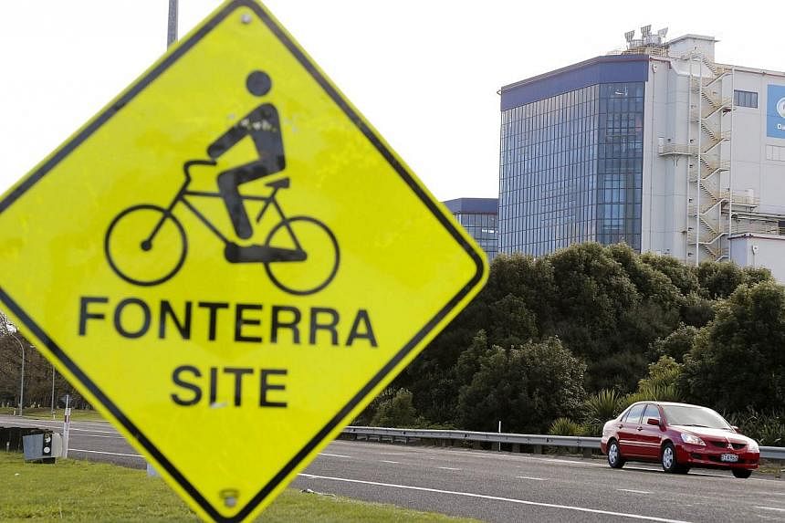 The Fonterra Te Rapa plant is seen behind a sign board for cyclists near Hamilton, in this August 6, 2013 file photo. Until last year, formula sourced from New Zealand was seen as the gold standard for quality in China where food scandals are common 
