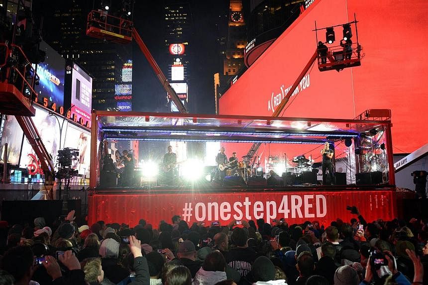 The Edge, Larry Mullen Jr. of U2 and Coldplay’s Chris Martin perform during the World AIDS Day (RED) concert in Times Square in New York on Monday. The US is considering easing a ban&nbsp;on blood donations by gays that was&nbsp;established in 1983