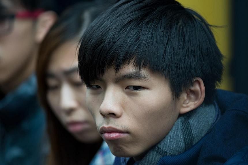 Leader of student group Scholarism, Joshua Wong attends a press conference at the pro-democracy movement's main protest site in the Admiralty district of Hong Kong on Dec 4, 2014.&nbsp;Hong Kong's student leaders said Thursday they would decide in th