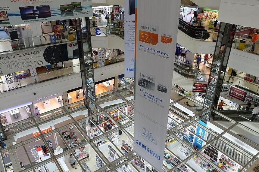 Police are investigating two mobile phone retailers at Sim Lim Square, after reports were lodged against them. -- PHOTO: ST FILE