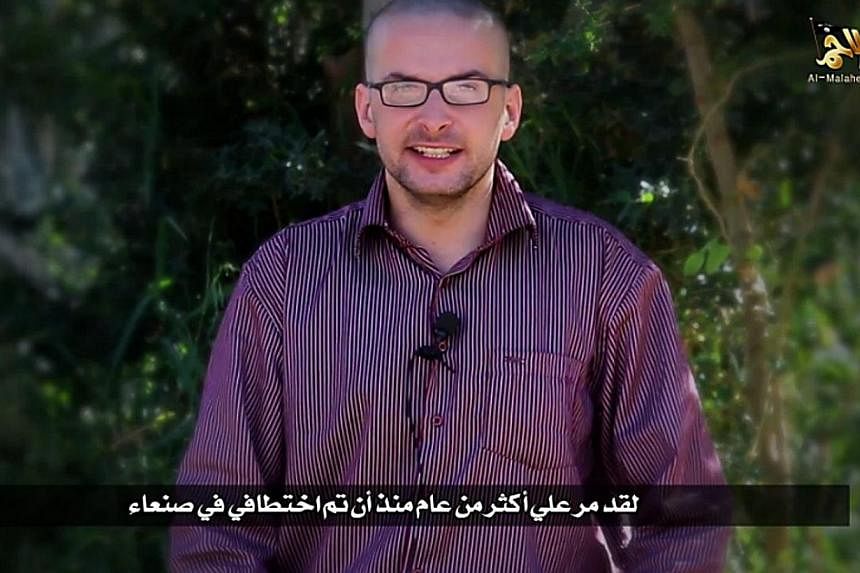 A video grab taken from a propaganda video released by al-Malahem Media on Dec 4, 2014 purportedly shows US hostage Luke Somers, 33, kidnapped more than a year ago in the Yemeni capital Sanaa, calling for help and saying that his life is in danger.&n