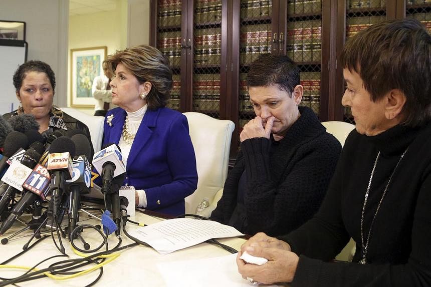 A woman who gave her name only as Chelan (left), Beth Ferrier, (second right), Helen Hayes (right) and their attorney Gloria Allred attend a news conference in Los Angeles, California on Dec 3, 2014. The three women came together to speak publicly ab