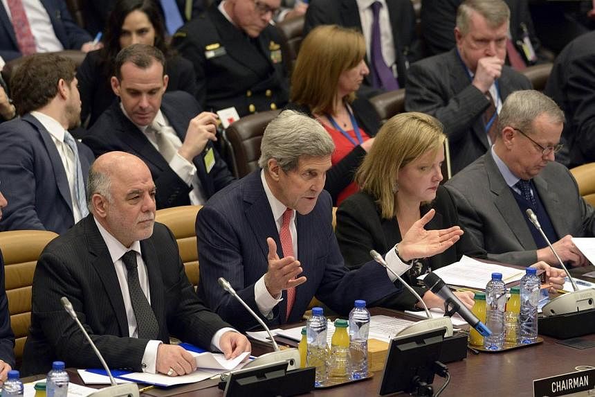 US Secretary of State John Kerry speaks during a round table meeting of the global coalition to counter the Islamic State in Iraq and Syria militant group at Nato headquarters in Brussels Dec 3, 2014. -- PHOTO: REUTERS