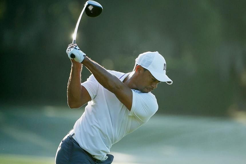 Tiger Woods hits a shot on the practice ground during the pro-am prior to the start of the Hero World Challenge at the Isleworth Golf &amp; Country Club on Dec 3, 2014 in Windermere, Florida. -- PHOTO: AFP