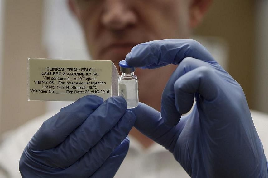 Professor Adrian Hill, Director of the Jenner Institute, and Chief Investigator of the trials, holds a phial containing the Ebola vaccine at the Oxford Vaccine Group Centre for Clinical Vaccinology and Tropical Medicine (CCVTM) in Oxford, southern En