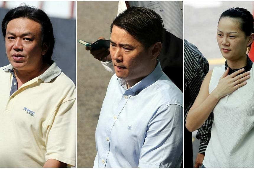Nineteen people were charged in a district court on Friday with conspiracy to cheat insurance companies in a motor insurance scam. Among them were (from left) Su Chia Ern, who chalked up the most charges, and a couple, Godfrey Liew Kok Hon and his Ch