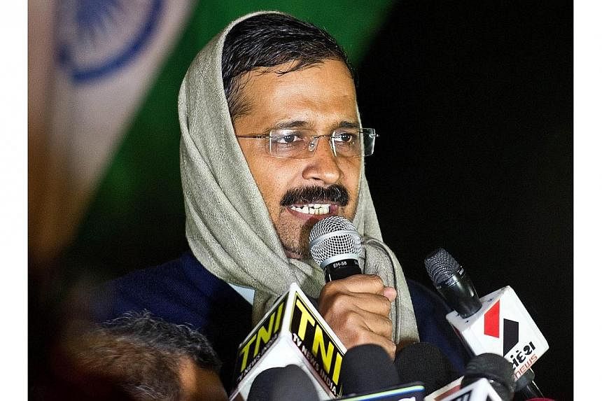 Delhi's then-chief minister Arvind Kejriwal addresses media at the venue of his sit-in protest in New Delhi on Jan 21, 2014.&nbsp;The leader of India's anti-corruption "Common Man's Party", a long-time scourge of the country's elite, drew widespread 