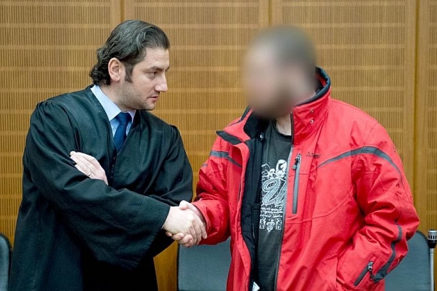 Kreshnik Berisha, 20, a jihadist militant, welcomes his lawyer Mutlu Guenal off the dock in a high-security facilities of the Higher Regional Court in Frankfurt am Main (Hessen).&nbsp;A German court Friday jailed a militant for three years and nine m
