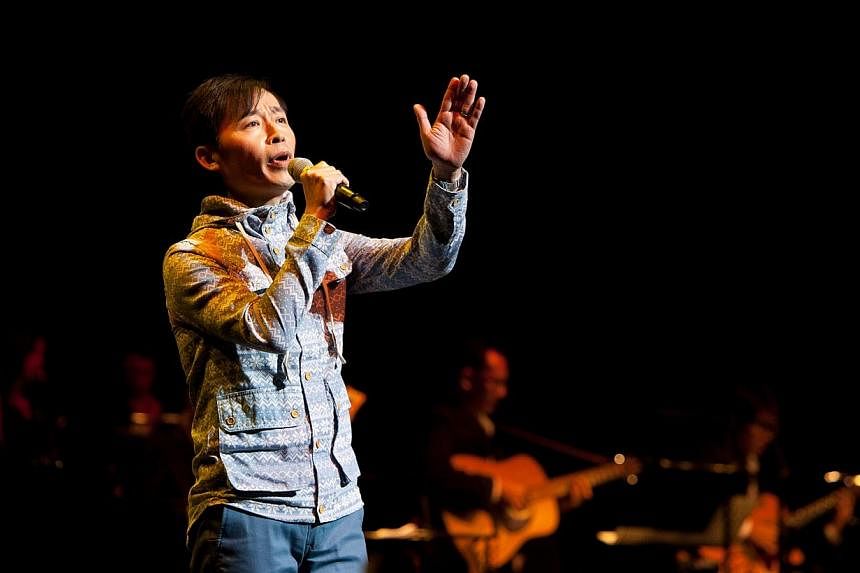 Singer-songwriter Liang Wern Fook performing at a Xinyao Reunion Concert at The Star Theatre. He has never held a concert of his own and will be holding a gig centred on his works at The Star Theatre on April 11, 2015. -- PHOTO:&nbsp;TCR MUSIC STATIO