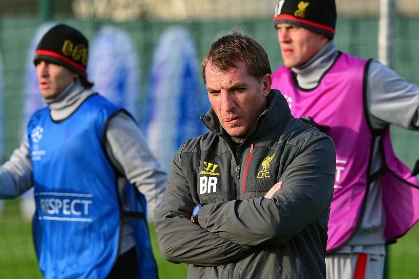 Liverpool manager Brendan Rodgers (foreground) supervises a training session at their Melwood training ground on Nov 25, 2014. Rodgers was given a vote of confidence on Thursday by the club's chief executive Ian Ayre, who dismissed recent speculation