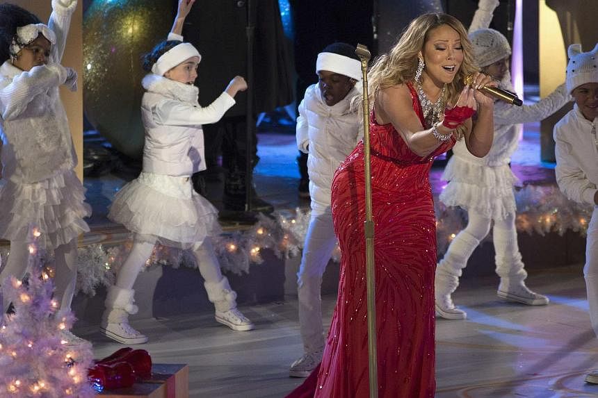 Singer Mariah Carey performs at the lighting ceremony for the 82nd Rockefeller Centre Christmas tree, in midtown Manhattan, New York City, Dec 3, 2014. -- PHOTO: REUTERS&nbsp;