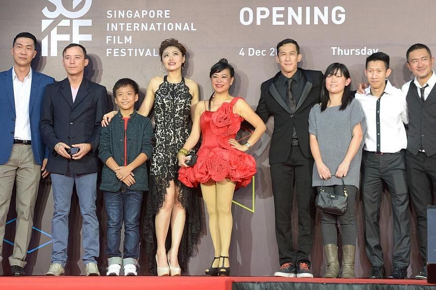 Director Ken Kwek (left) with his Unlucky Plaza team at Shaw House on Dec 4, 2014. -- ST PHOTO: LIM SIN THAI