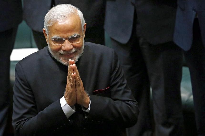 India's Prime Minister Narendra Modi enters the House of Representatives to make a speech in Australia's Parliament House in Canberra on Nov 18, 2014. -- PHOTO: REUTERS