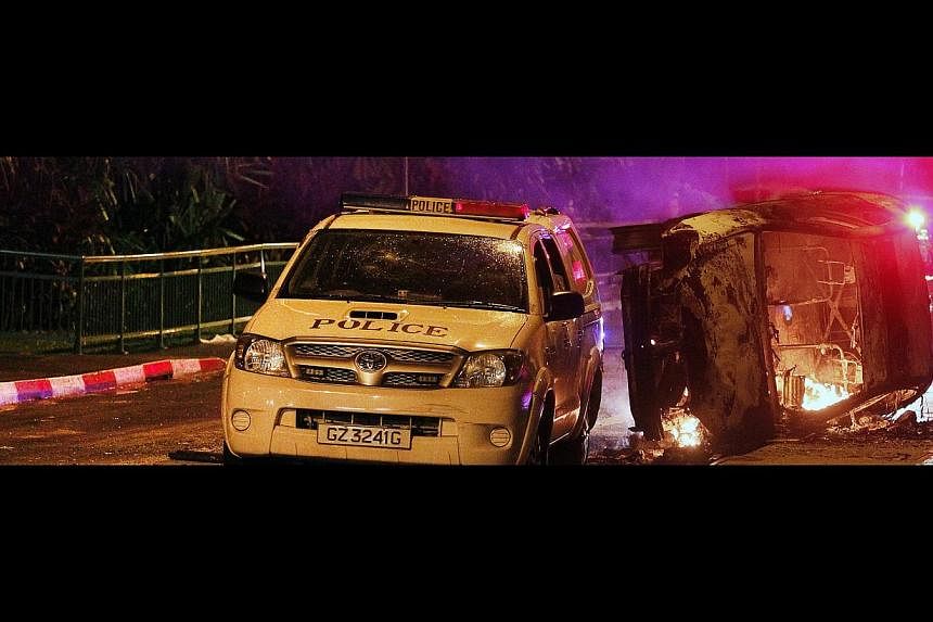 One of the vehicles which were torched during the Little India riot on Dec 8 last year. A mob of about 400 people had turned violent and attacked emergency vehicles responding to a fatal accident. -- ST PHOTO: MARK CHEONG