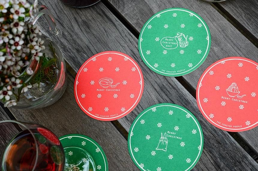 Christmas coasters featuring drinks and dishes unique to Singapore. -- PHOTO: THE COASTER PEOPLE
