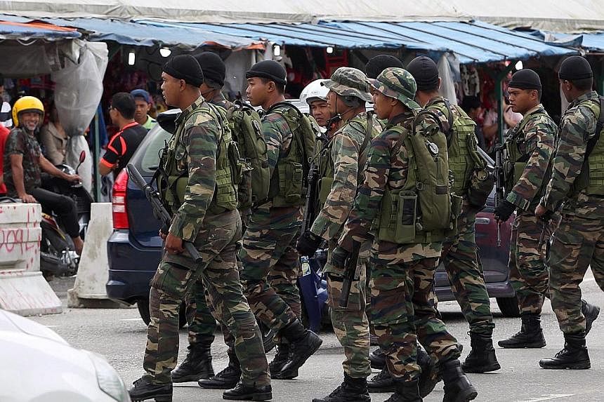 Police are keeping tab on the Malaysian armed forces as several personnel have been detected to be sympathisers of the Islamic State in Iraq and Syria (ISIS) militant group waging war in the Middle East. -- PHOTO: THE STAR PUBLICATION