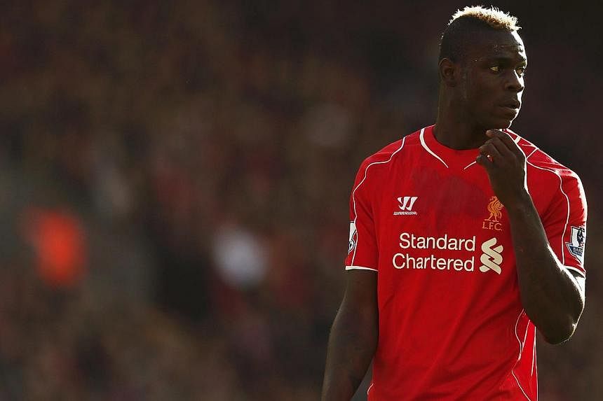 Liverpool striker Mario Balotelli (above) was charged by the Football Association on Friday for re-posting a message on Instagram that contained racist and anti-Semitic references. -- PHOTO: REUTERS