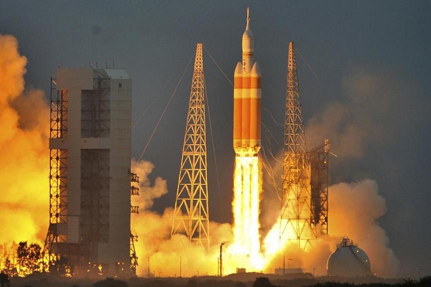 The Delta IV Heavy rocket with the Orion spacecraft lifts off from the Cape Canaveral Air Force Station in Cape Canaveral, Florida Dec 5, 2014. Nasa's unmanned Orion space capsule splashed down in the Pacific Ocean off Baja California on Friday follo