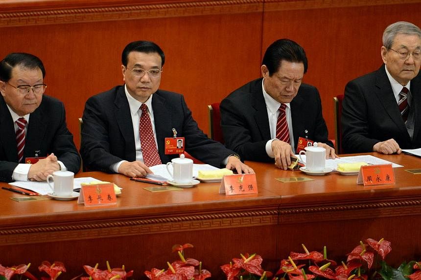 A file photo taken on Nov 8, 2012 shows Chinese leaders (from left) Li Changchun, Vice-Premier Li Keqiang, security chief Zhou Yongkang and former premier Zhu Rongji attending the opening of the 18th Communist Party Congress at the Great Hall of the 