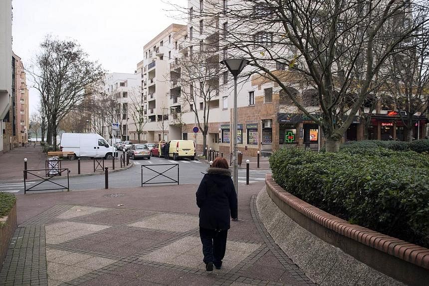 A woman walks in a street of Creteil, outside of Paris, on Dec 4, 2014 after a violent assault targeting a Jewish couple on Dec 1, 2014.&nbsp;France's interior minister vowed Sunday to make the fight against anti-Semitism a "national cause" after the