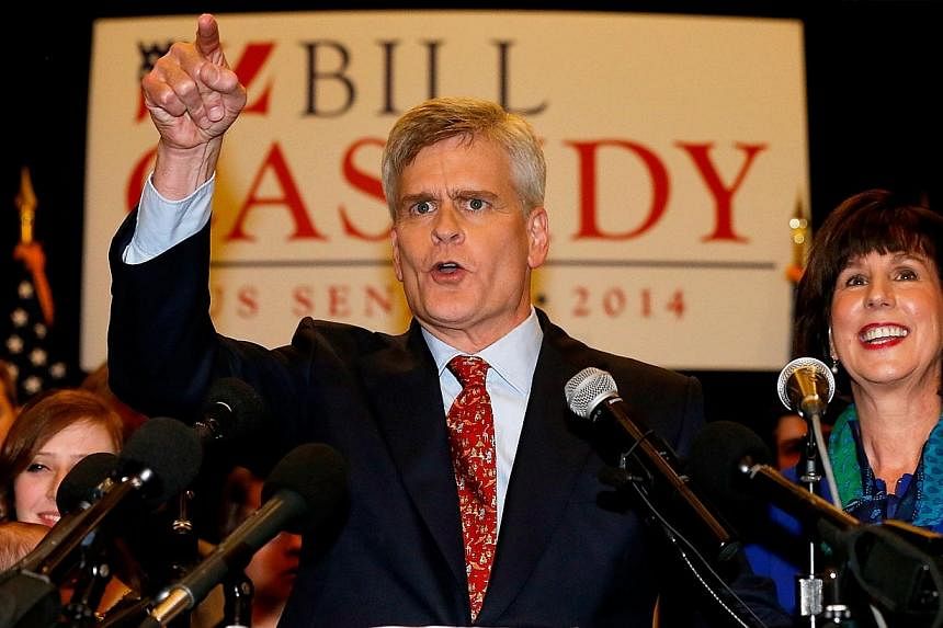 US Senator elect Bill Cassidy (R-LA) celebrates with supporters after defeating Senator Mary Landrieu at the Crowne Plaza Hotel during an election night watch party on Dec 6, 2014 in Baton Rouge, Louisiana. -- PHOTO: AFP