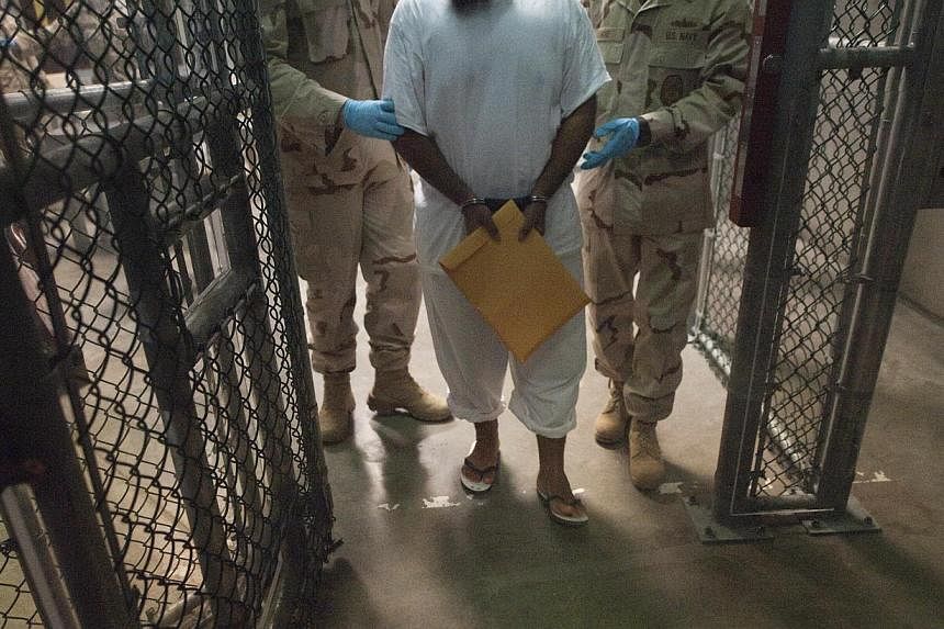 Six men held for more than a decade at the US military prison at Guantanamo Bay, Cuba, were sent to Uruguay for resettlement on Sunday, the Pentagon said, the latest step in a slow-moving effort by the Obama administration to close the facility. -- P