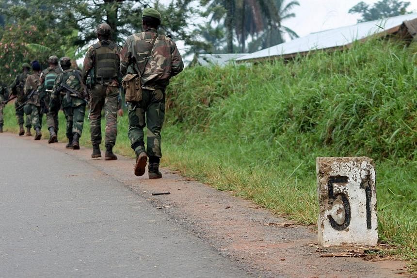 A file photo taken on Dec 31, 2013, shows Democratic Republic of Congo (FARDC) soldiers marching in Eringeti towards the front line in Beni to fight against the Allied Democratic Forces and the National Army for the Liberation of Uganda (ADF-Nalu), a