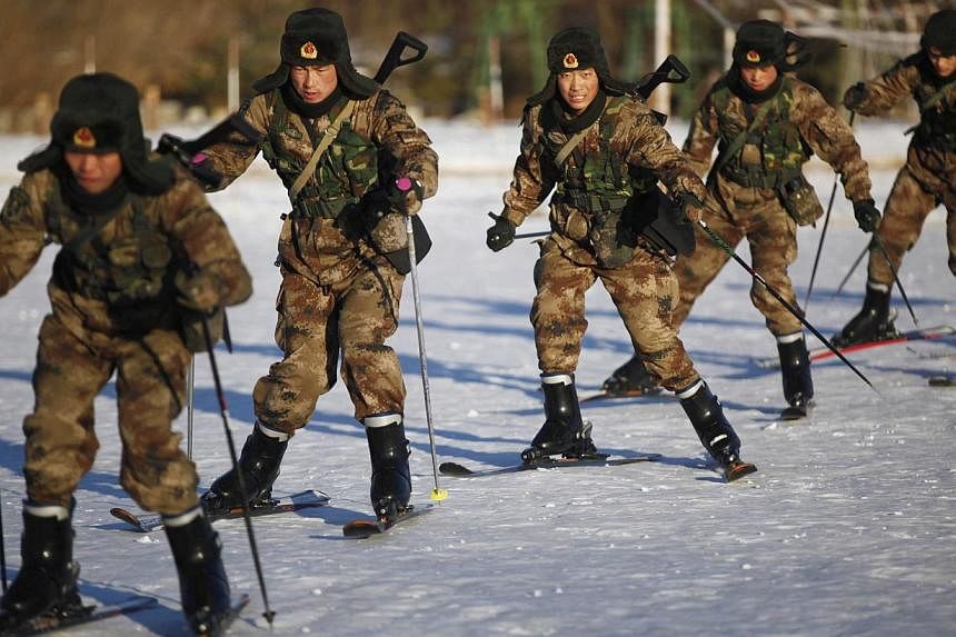 Soldiers of China's People's Liberation Army (PLA) practice skiing in sub-zero temperatures in Heihe, Heilongjiang province, on Nov 13, 2014.&nbsp;An army general has warned that China will not leave the Taiwan problem "unresolved for a long time", a