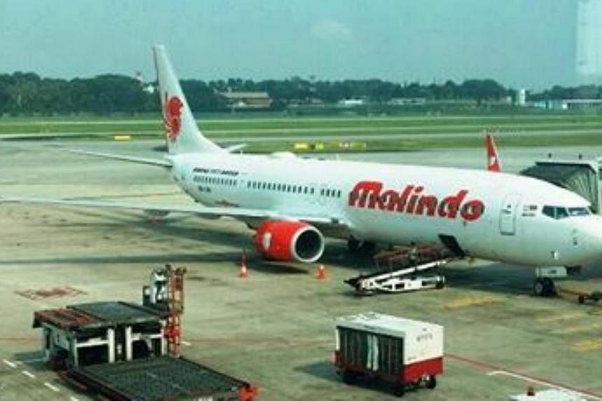 Malindo Air's plane parked in Changi Airport. The Malaysia-based&nbsp;airline was officially welcomed at Changi Airport on Monday morning to mark their recent launch of daily flights between Kuala Lumpur and Singapore. -- PHOTO: MALINDO AIR/FACEBOOK