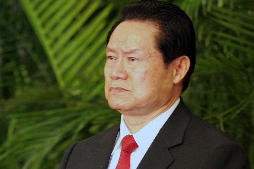 Mr Zhou Yongkang, 72, faces a judicial probe for a slew of charges, including taking bribes, helping family members and cronies plunder government assets, and leaking official secrets, according to the official Xinhua news agency.&nbsp;-- PHOTO: CHIN