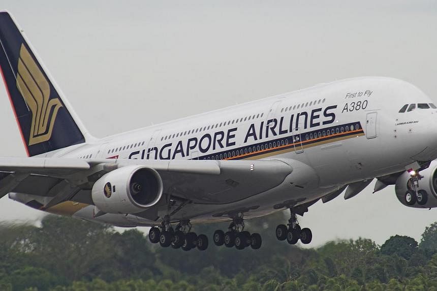 Singapore Airlines (SIA) says it will honour hundreds of business-class tickets sold at economy-class fares in Australia due to a computer glitch. -- PHOTO: SIA