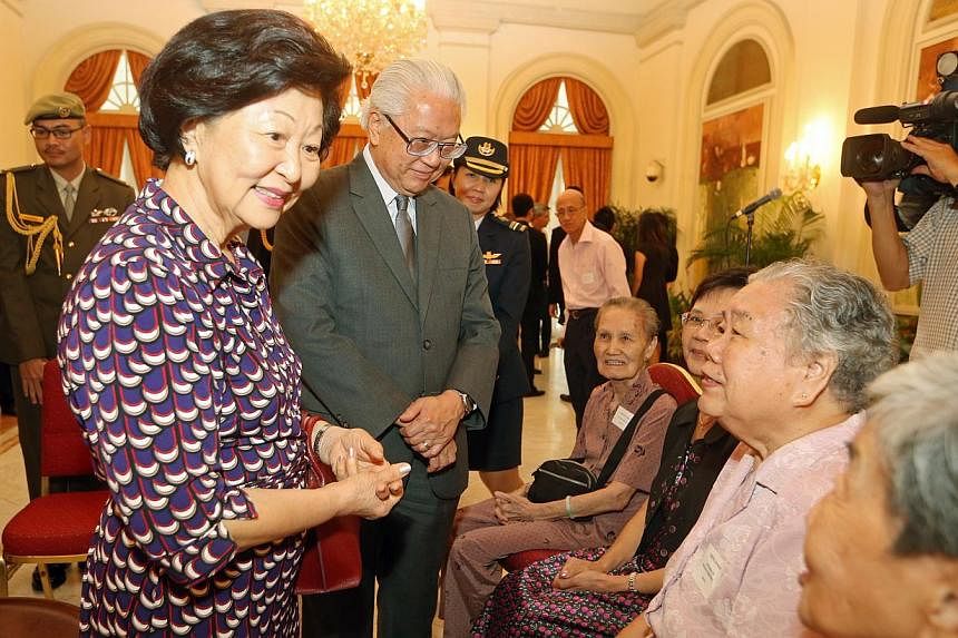 President Tony Tan Keng Yam and wife Mary Tan hosted tea for 60 volunteers including those from the elderly sector like (from right) Yoong Lin Heng, 76 (NTUCHealth Silverace@Redhill), Cheng Lai Woh, 81 (NTUCHealth Silverace@Redhill), Lim Tai Foon, 62