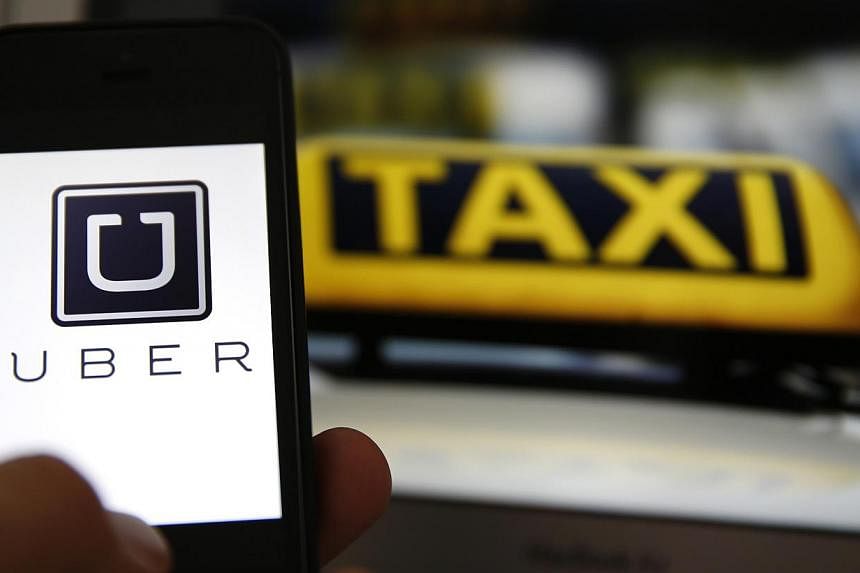 Dutch judges on Monday banned the popular ride-sharing service UberPOP from taking bookings via its smartphone app, threatening US company Uber with fines of up to 100,000 euros (S$162,145). -- PHOTO: REUTERS