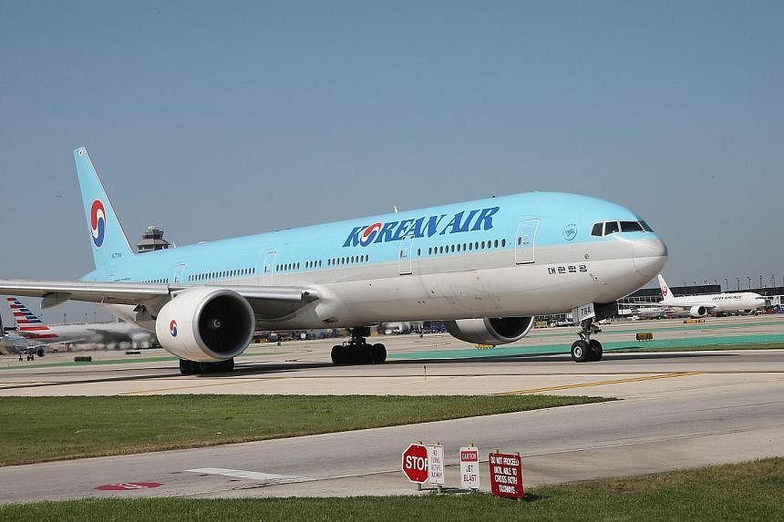 Korean Air apologised as it faced a media backlash over the daughter of the airline's chief executive, who had a chief purser ejected from a plane in a furious reaction to being incorrectly served some macadamia nuts. -- PHOTO: AFP&nbsp;