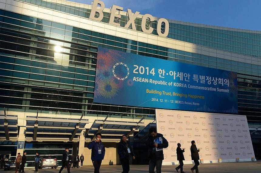 Securtiy personnel stand outside BEXCO, a convention and exhibition centre, in Busan, South Korea, in preparation for the Asean-ROK Summit happening between Dec 11-12.&nbsp;Prime Minister Lee Hsien Loong leaves for South Korea on Wednesday to the sum
